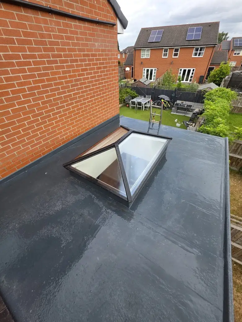Flat roof with a roof lantern on a red brick house