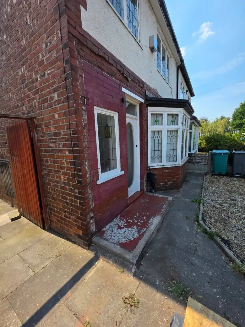 Side extension on an older brick house with the scaffold still up