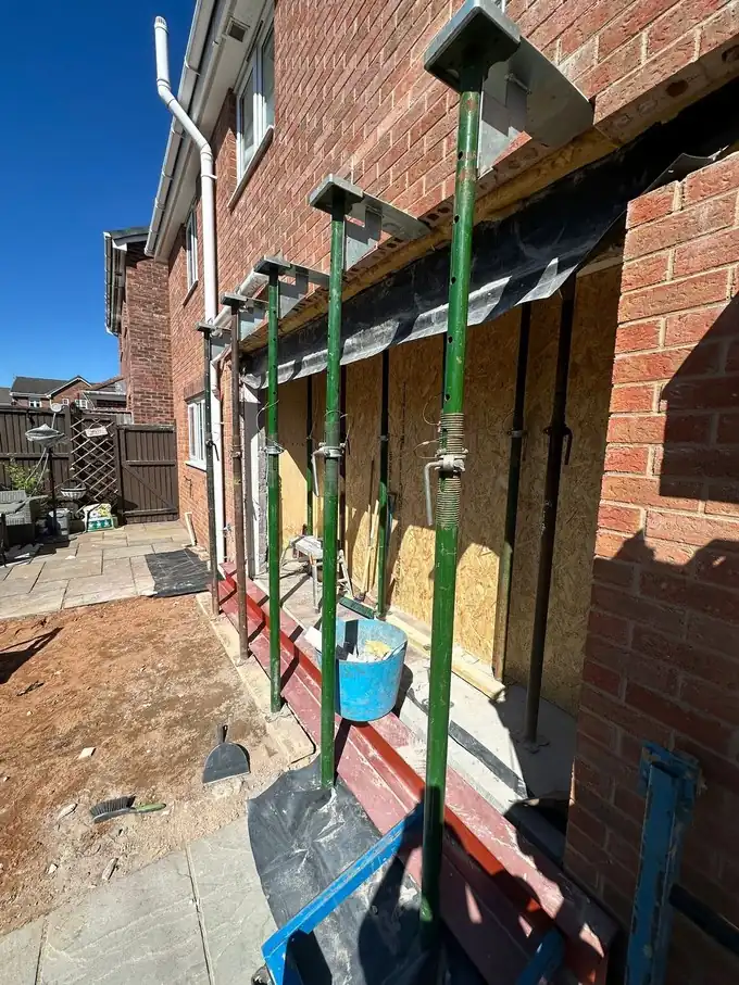 Steel fitted across the new opening at the back of the house